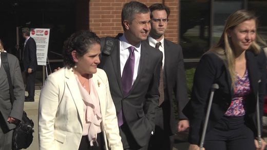 Nicole Eramo leaving court with members of her legal team