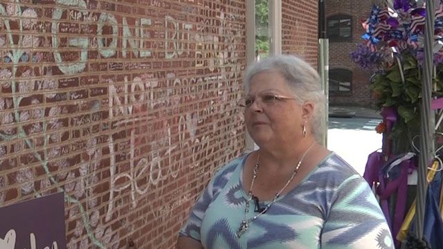 Susan Bro next to a memorial for her daughter, Heather Heyer