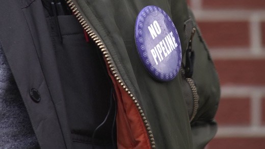 A "NO PIPELINE" button on Quinn Robinson's jacket